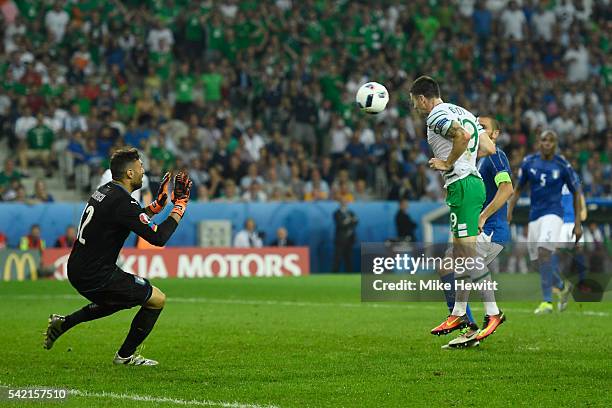 Robbie Brady of Republic of Ireland heads the ball to score the opening goal past Salvatore Sirigu of Italy during the UEFA EURO 2016 Group E match...