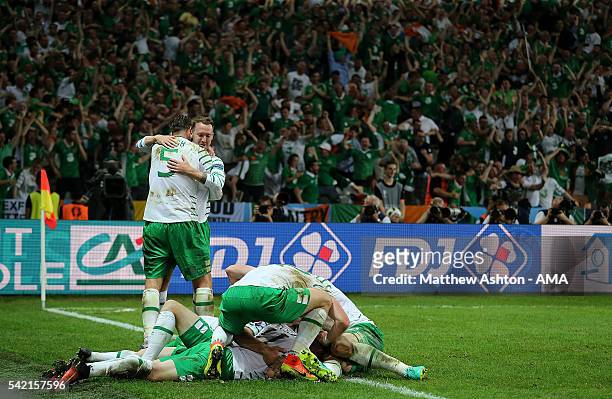 Robbie Brady of Ireland celebrates with his team-mates after scoring a goal to make the score 0-1 during the UEFA EURO 2016 Group E match between...