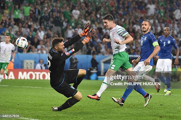 Ireland's midfielder Robert Brady scores a goal past Italy's goalkeeper Salvatore Sirigu during the Euro 2016 group E football match between Italy...