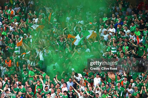 Ireland supporter light a flare to celebrate their team's first goal during the UEFA EURO 2016 Group E match between Italy and Republic of Ireland at...