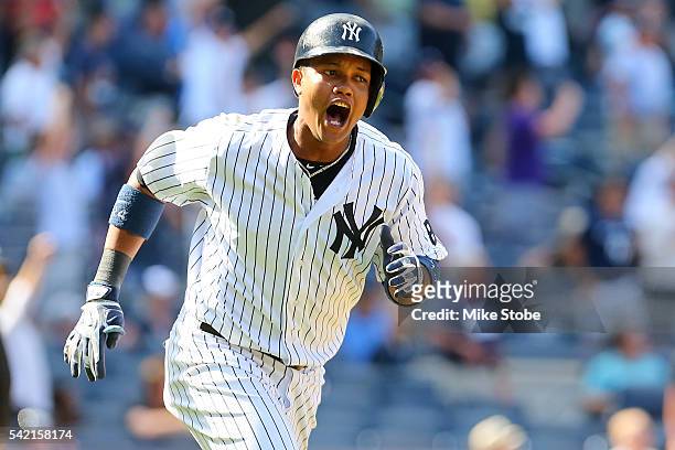 Starlin Castro of the New York Yankees celebrates after hitting a game winning solo home run in the bottom of the ninth-inning to defet the Colorado...