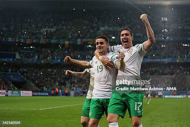 Robbie Brady of Ireland celebrates with team-mate Stephen Ward at the end of the UEFA EURO 2016 Group E match between Italy and Republic of Ireland...
