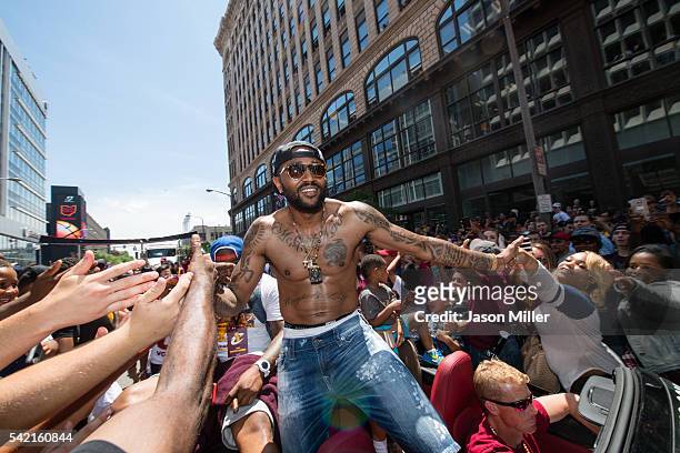 Mo Williams of the Cleveland Cavaliers celebrates with fans during the Cleveland Cavaliers 2016 championship victory parade and rally on June 22,...