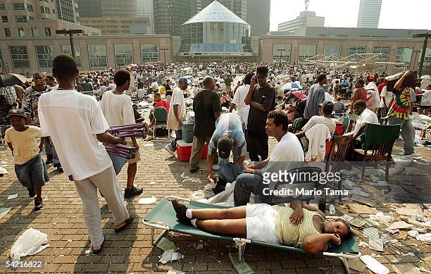Stranded victims of Hurricane Katrina wait outside the Superdome to be evacuated September 2, 2005 in New Orleans, Louisiana. Thousands of troops...