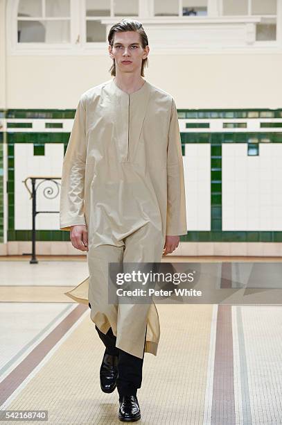 Model walks the runway during the Lemaire Menswear Spring/Summer 2017 show as part of Paris Fashion Week on June 22, 2016 in Paris, France.