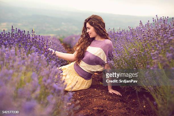 happy with her flowers - lavender stock pictures, royalty-free photos & images