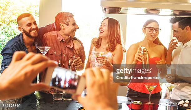 group of friends toasting with drinks - cocktail shaker stock pictures, royalty-free photos & images