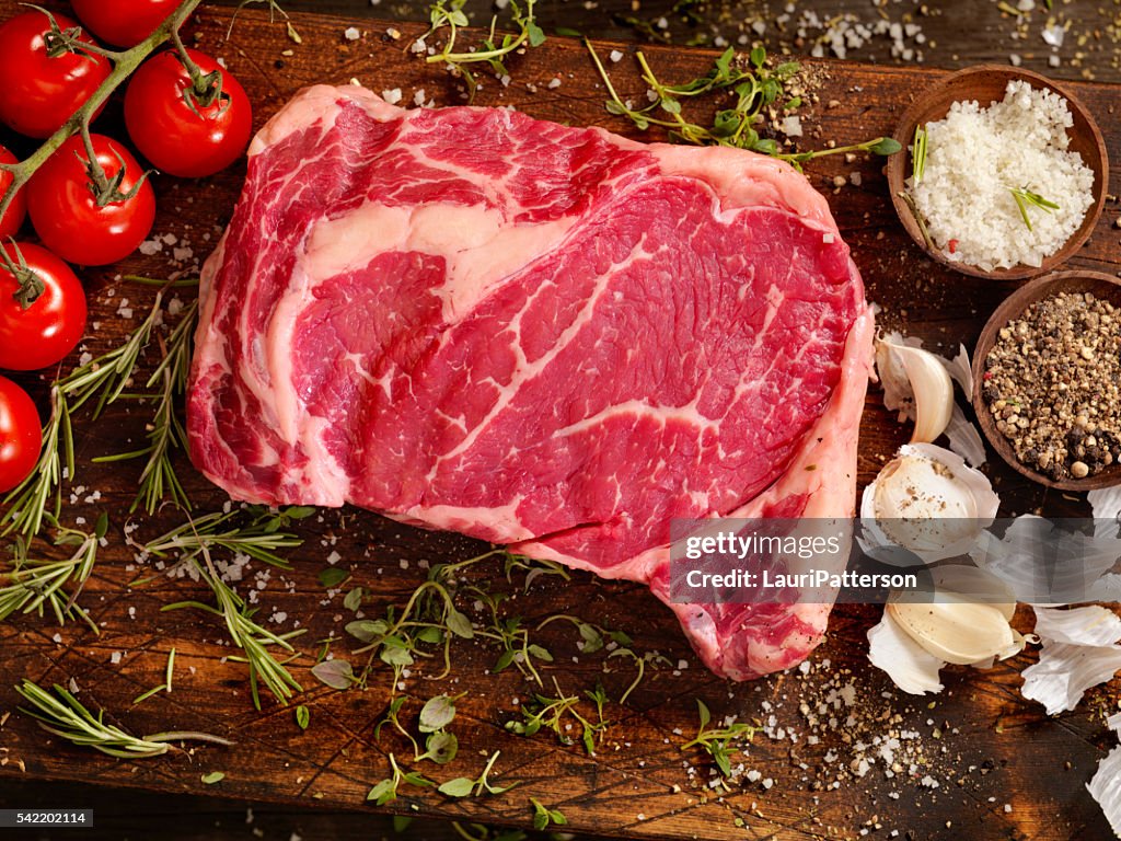 Raw Rib Eye Steak with Fresh Herbs