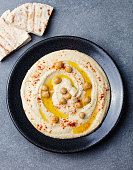 Hummus, chickpea dip, spices and pita, flat bread Top view