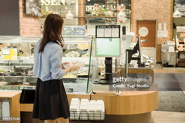young woman buying grocery in supermarket - side dish stock pictures, royalty-free photos & images