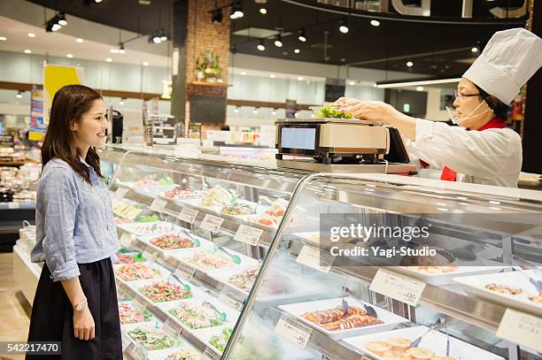 young woman buying grocery in supermarket - side dish stock pictures, royalty-free photos & images