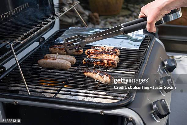 bbq in the back garden - totland bay stock pictures, royalty-free photos & images