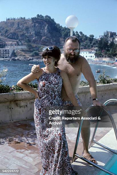 Italian actor Sergio Leone with his wife Carla in a swimming pool. 1972