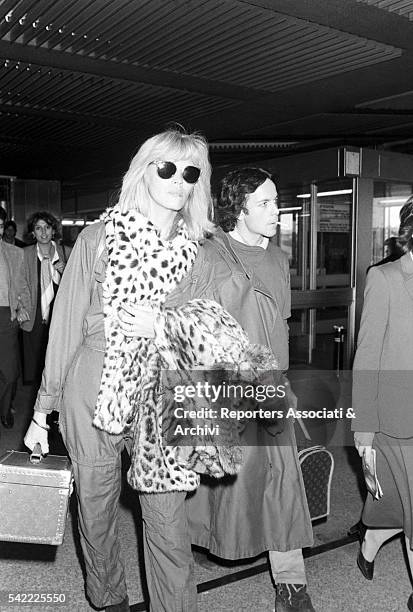 French showgirl Amanda Lear and her husband Alain-Philippe Malagnac in Fiumicino airport. Rome, 1985