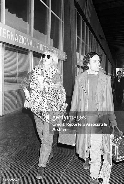 French showgirl Amanda Lear and her husband Alain-Philippe Malagnac in Fiumicino airport. Rome, 1985