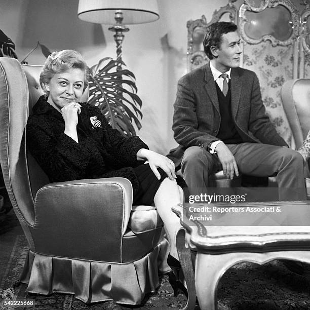 British playwright John Osborne talking to Italian actress Giulietta Masina at Club theater after a recital of British plays. Rome, 1959