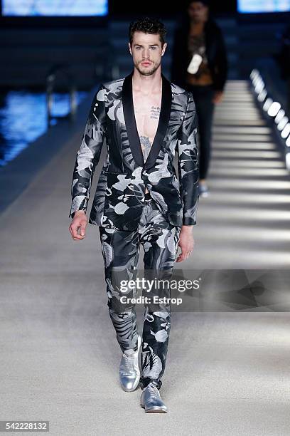 Model walks the runway at the Dirk Bikkembergs show during Milan Men's Fashion Week SS17 on June 20, 2016 in Milan, Italy.