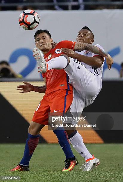 Frank Fabra of Colombia kicks the ball away from Charles Aranguiz of Chile during a semi-final match in the 2016 Copa America Centernario at Soldier...