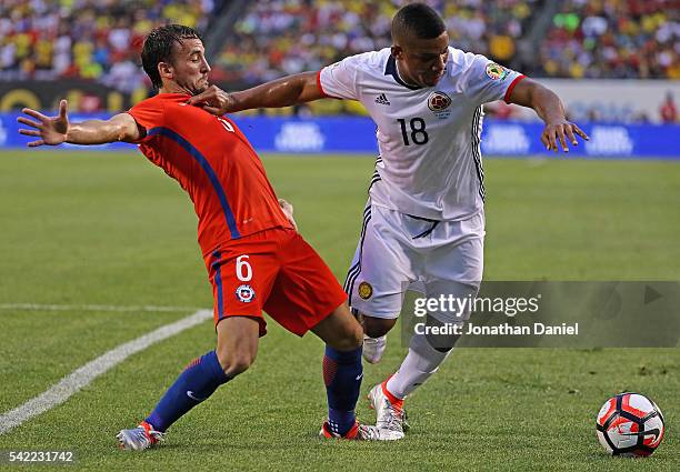 Frank Fabra of Colombia holds off Jose Pedro Fuenzalida of Chile during a semi-final match in the 2016 Copa America Centernario at Soldier Field on...