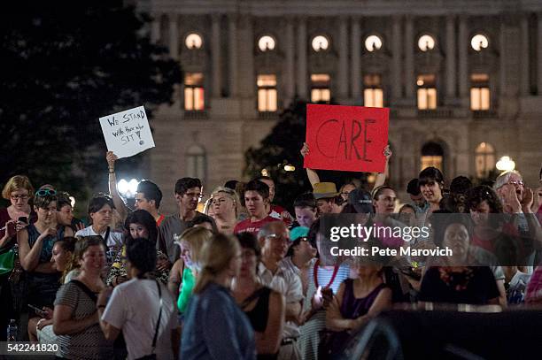 Supporters of House Democrats taking part in a sit-in on the House Chamber shout encouragement from outside the U.S. Capitol on June 22, 2016 in...