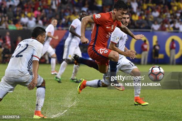 Chile's Charles Aranguiz vies for the ball with Colombia's Sebastian Perez and Colombia's Jeison Murillo during a Copa America Centenario semifinal...