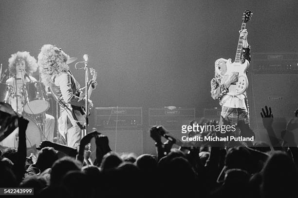 English rock group Slade performing on one of their two nights at the New Victoria Theatre, London, 25th-26th April 1975. Left to right: Don Powell,...