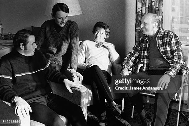 French actor and singer André Bourvil with wife Jeanne Lefrique and sons Dominique and Philipps Raimbourg, on winter sports holiday.