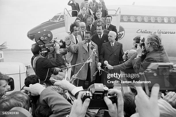 Brazilian footballer Pelé is welcomed at the Orly airport by Jacques Baumel, French Secretary of State for Prime Minister Jacques Chaban-Delmas.