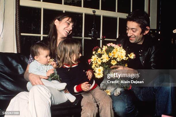 French singer and songwriter Serge Gainsbourg with his partner British singer and actress Jane Birkin, their daughter Charlotte , and Jane's...