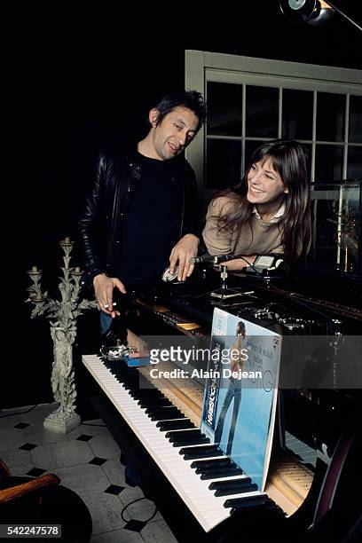 French singer and songwriter Serge Gainsbourg with his partner British singer and actress Jane Birkin at home in Paris.