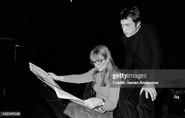 French actress Marina Vlady reads a newspaper in the Palais de Chaillot theater with her husband Vladimir Vysotsky, a Russian anti-establishment...