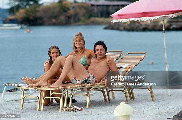 Paul McCartney, his wife Linda and daughter Mary relax on a summer vacation.