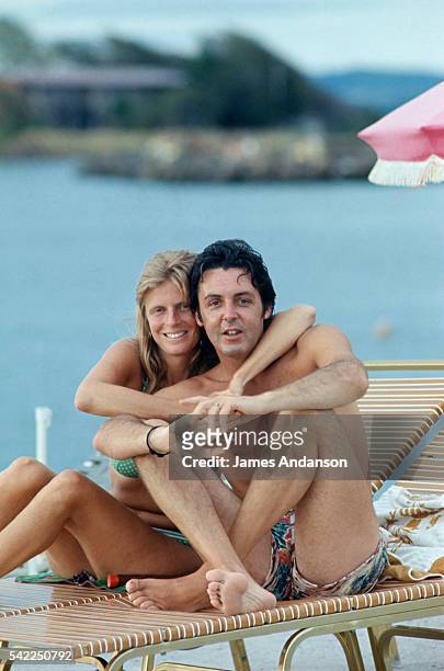 Paul McCartney and his wife Linda relax on a summer vacation.