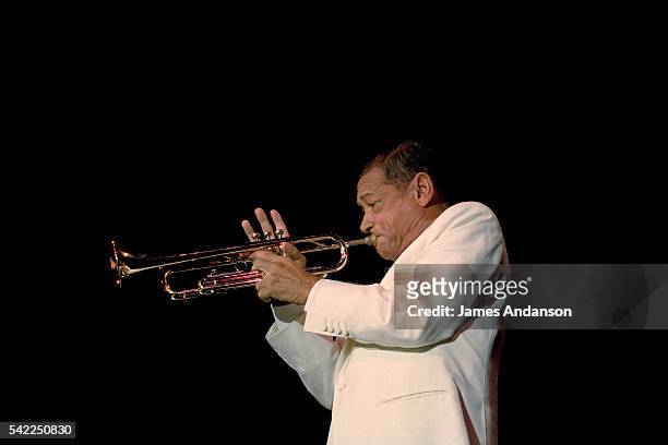 French musician, composer and singer Henri Salvador playing trumpet live in concert at the Casino de Paris.