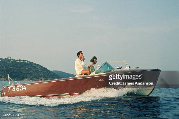French singers and composers Michel Polnareff and Gilbert Bécaud on a "Riva" speedboat during their summer holidays.