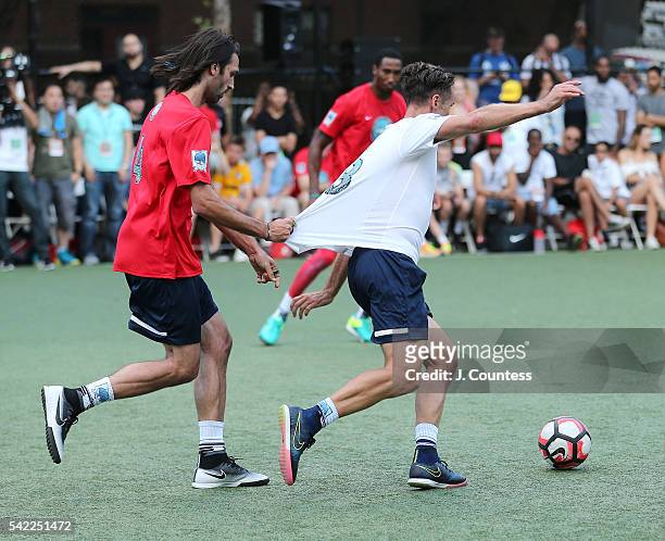 Retired NBA Player Steve Nash is pulled by a member of the opposing team during the 2016 Steve Nash Foundation Showdown at Sara D. Roosevelt Park on...
