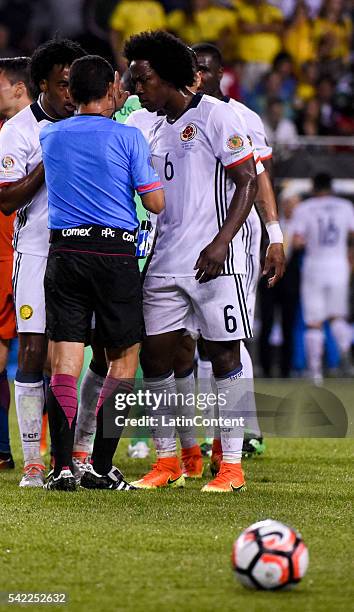 Carlos Sanchez of Colombia argues with the referee Joel Aguilar after he received a yellow card during a Semifinal match between Colombia and Chile...