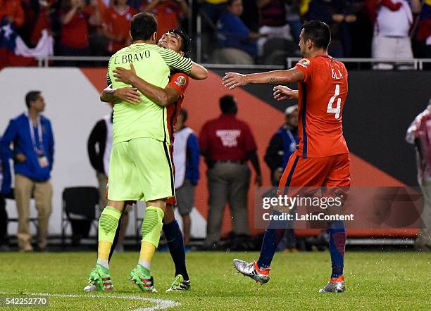 Gonzalo Jara, Claudio Bravo and Mauricio Isla of Chile celebrate after winning the Semifinal match between Colombia and Chile at Soldier Field as...