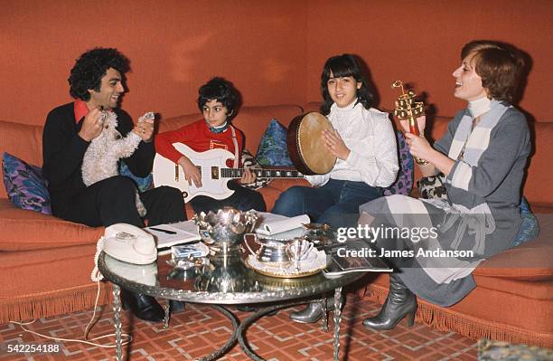 French singer Enrico Macias and his wife Suzy playing music and singing at home with their daughter Jocya and son, Jean-Claude Ghrenassia, who would...