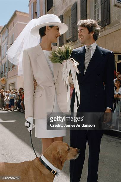 French model and fashion designer Ines de La Fressange and Luigi d'Urso walking towards the town hall of Tarascon, with their dog, for their wedding...