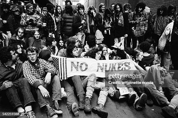 Protesters on Wall Street demonstrate against nuclear arms investments.