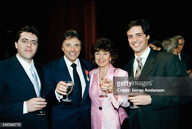 French singer Sacha Distel celebrates his Légion d'Honneur with his wife, Francine, and sons Julien and Laurent at the Olympia in Paris.