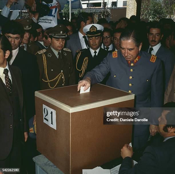 General Augusto Pinochet casts his vote during a referendum in Chile in 1980. 67% of the Chilean population have voted for Pinochet's constitution,...