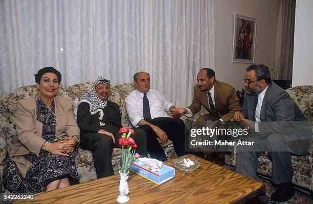 Yasser Arafat celebrates his return to Gaza with Hanane Ashraoui and Faical Husseini . Ashraoui is the spokesperson for the PLO and Husseini is a...