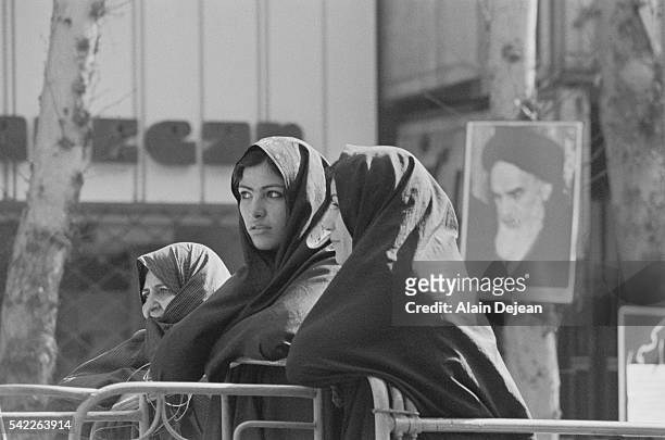 Iranian women wait for the return of the exiled Ayatollah Ruhollah Khomeini in Tehran during the Iranian Revolution.