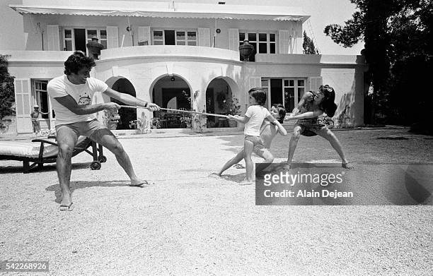 Sacha Distel and his wife Francine play with their sons Julien and Laurent. | Location: Le Rayol, Alpes Maritimes, France.