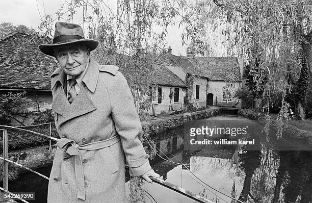 French poet and author Louis Aragon stands in front of the Moulin de Villeneuve, set in a six-hectare park, that he offered to his wife, the Russian...