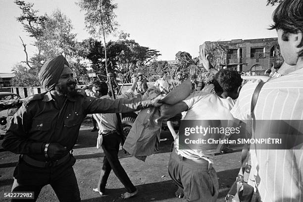 An Indian soldier with a prisoner during the Bangladesh War of Independence, December 1971.