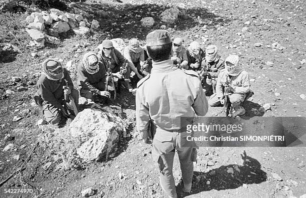 Members of the Popular Front for the Liberation of Palestine are briefed by PLPF leader Georges Habache before beginning military exercises in...