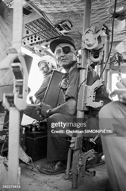 Moshe Dayan tours the Egyptian front in a helicopter.